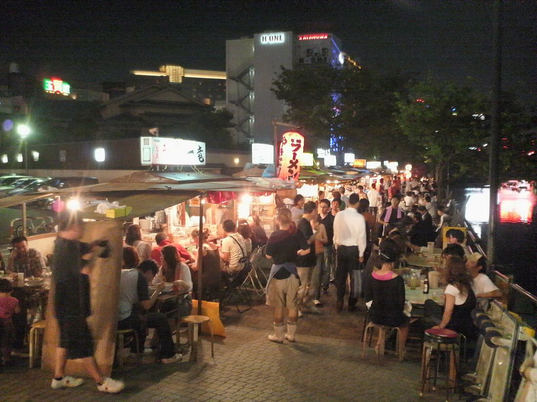 Yatai food stalls lit up along the Nakasu riverside