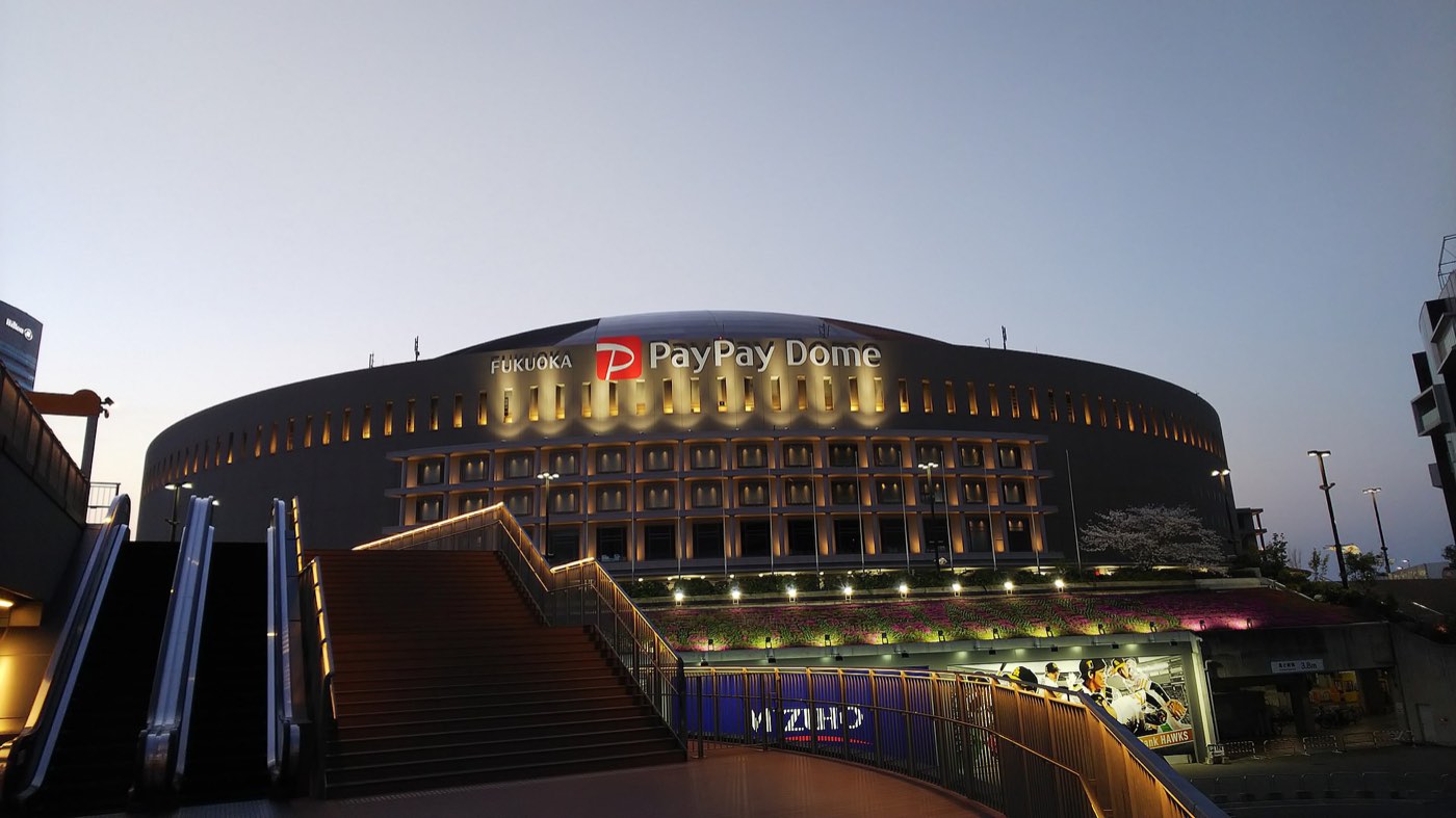 The Mizuho PayPay Dome lit up at night, home of BOSS E-ZO and teamLab Forest